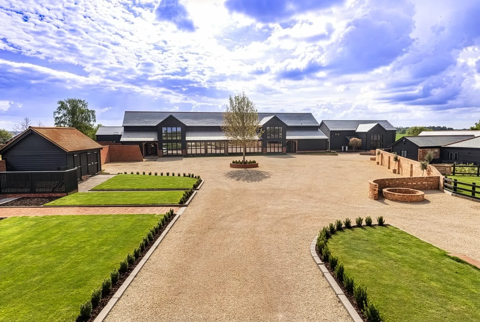 Completed Blythcarr barn development: courtyard, landscaping and converted barns