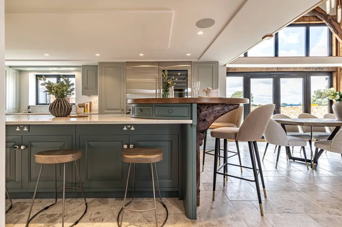 Design concept: oak-framed kitchen and dining in use, years after handover